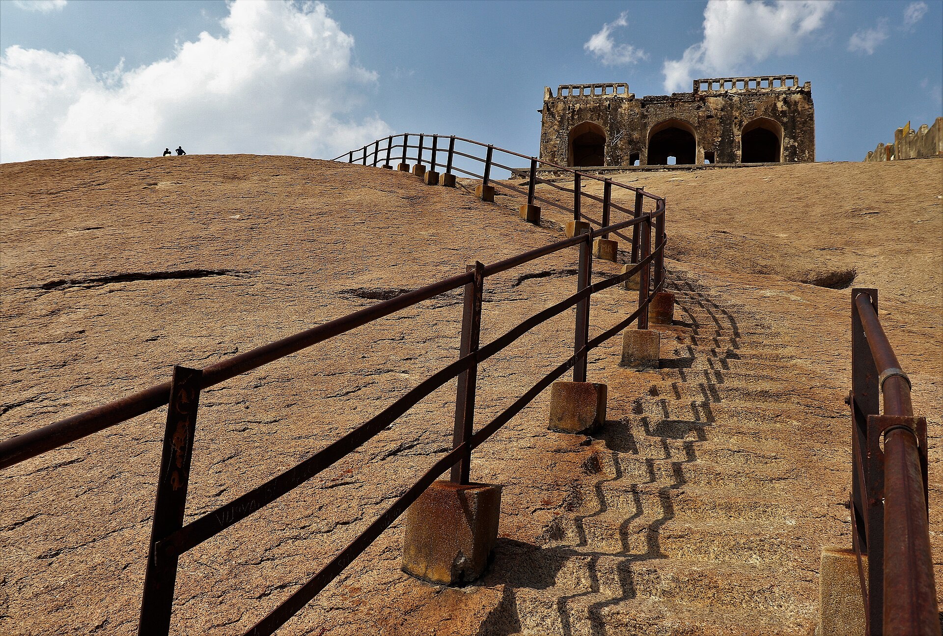 The climb up the Bhuvanagiri monolith, a single sheet of Deccan granite rising above the plain, crowned by a fort