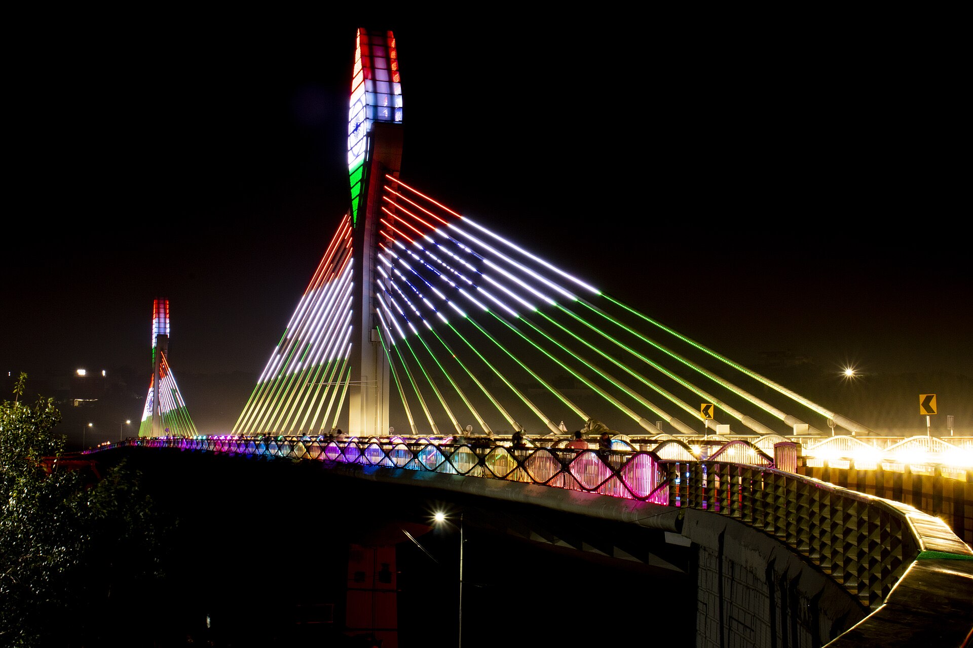 The Durgam Cheruvu cable bridge lit in tricolor at night, gateway to Hyderabad's financial district