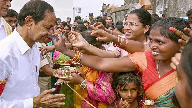 KCR greeting a crowd of women during a village visit in Telangana