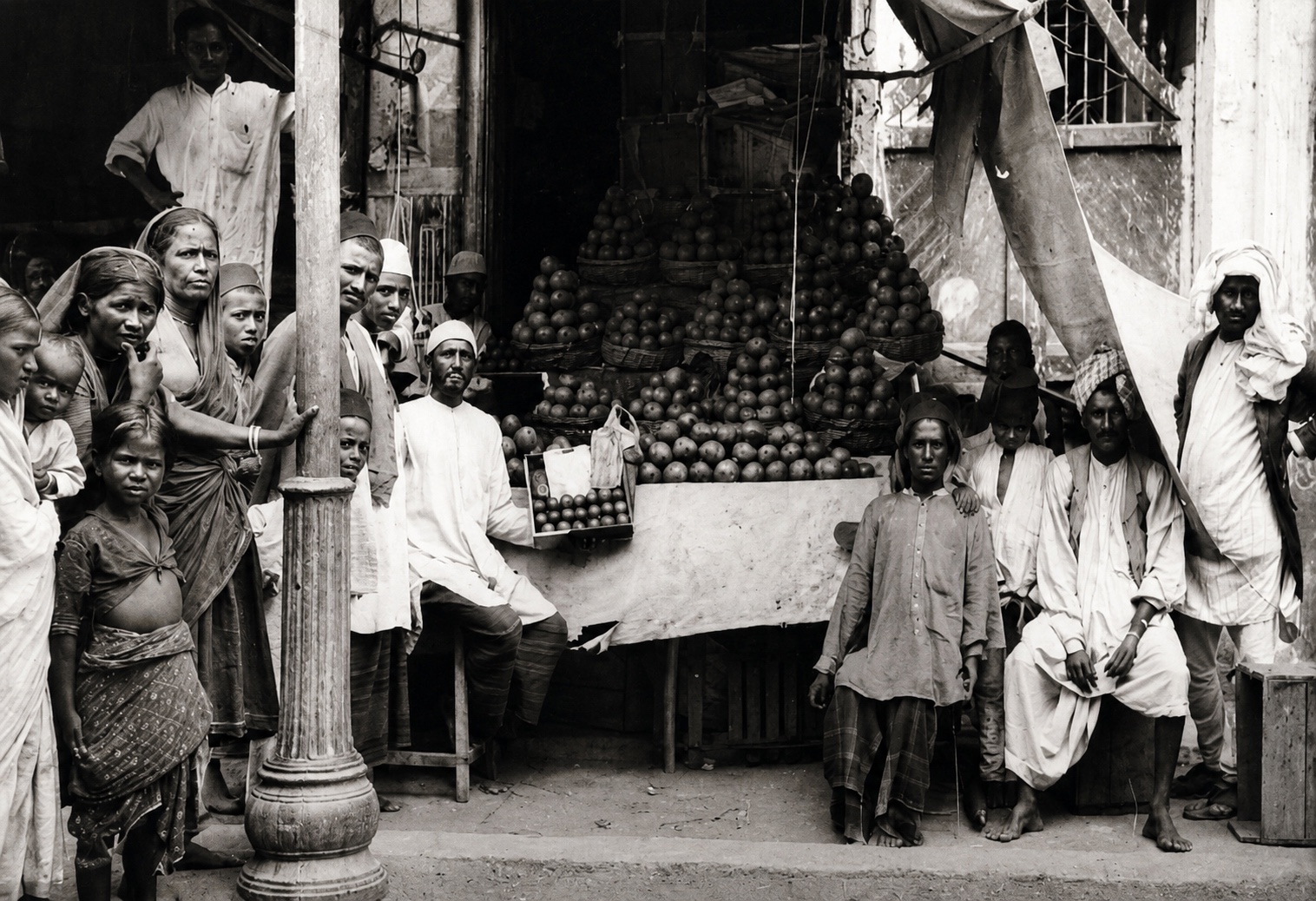 A market scene in Hyderabad in the 1920s, with vendors, fruit stalls and passersby