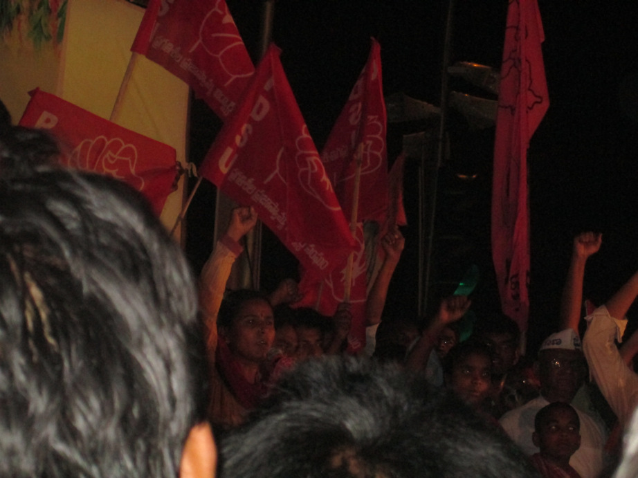 A pro-Telangana rally at night, slogans raised under PDSU flags