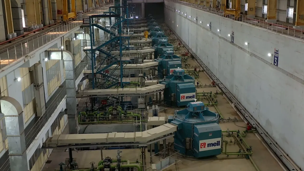 Inside the Lakshmi pump house: a long hall lined with large pump motor units
