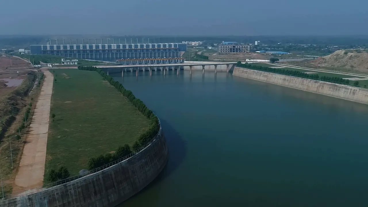 The Lakshmi pump house at Medigadda seen from the air, a long hall beside a wide approach channel